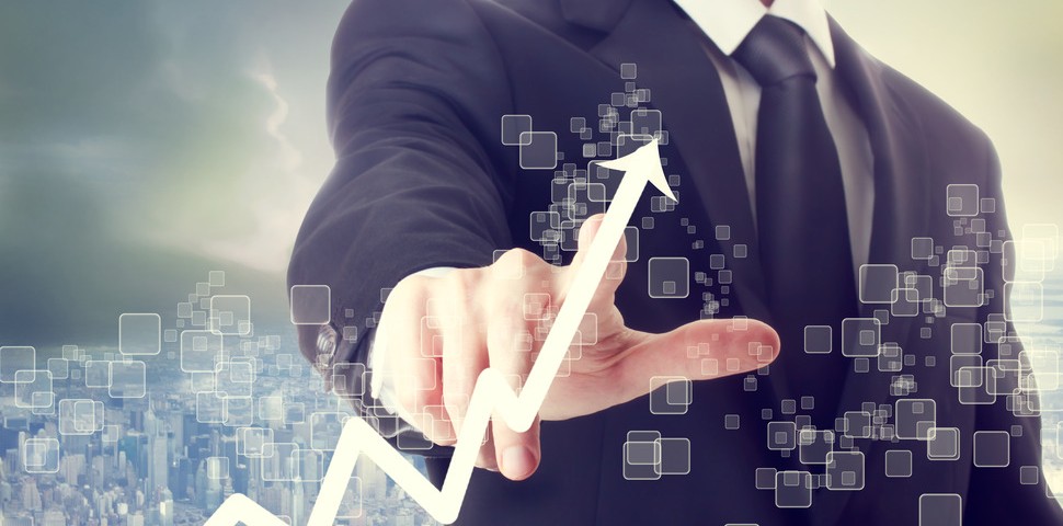 Businessman Touching a Graph Indicating Growth